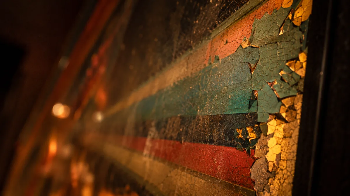 Close-up detail of vintage pinball hardware under game room lighting