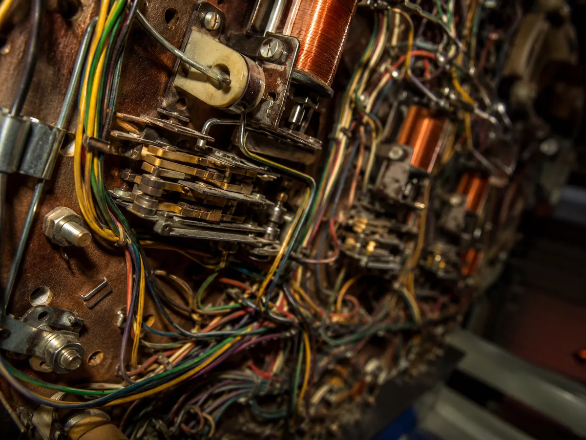 Wiring harness, coils and switch stacks beneath a pinball playfield